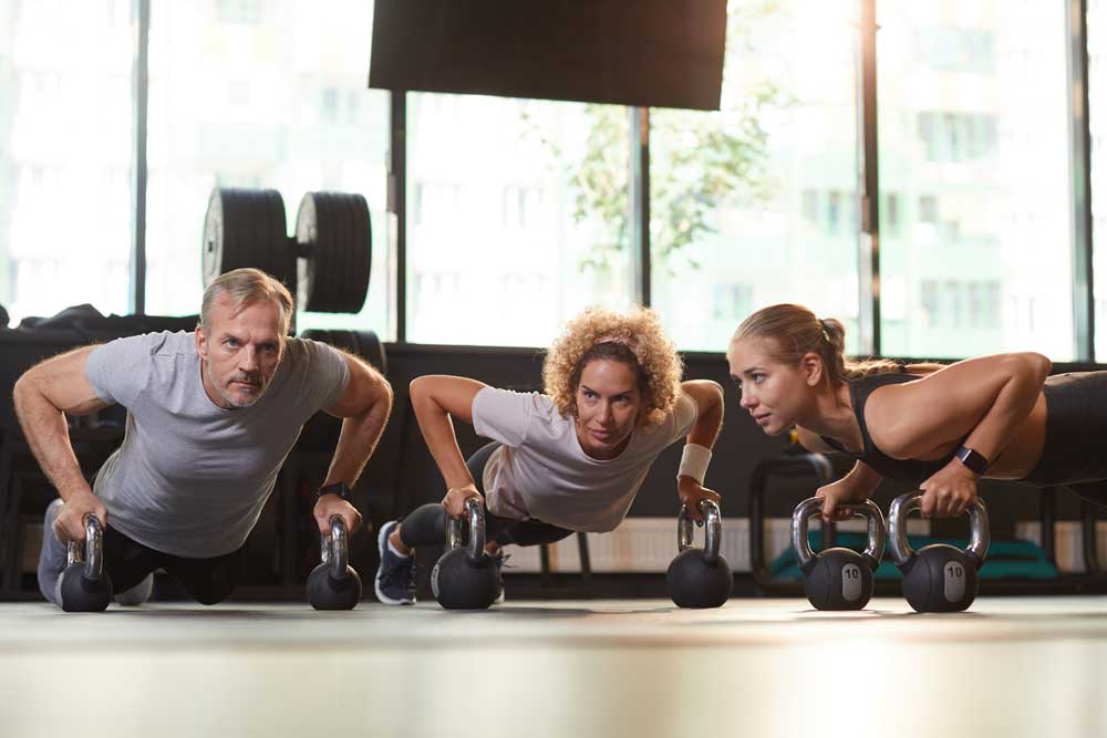 People Training With Dumbbells