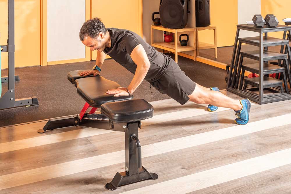 Push Ups On Bench In The Gym